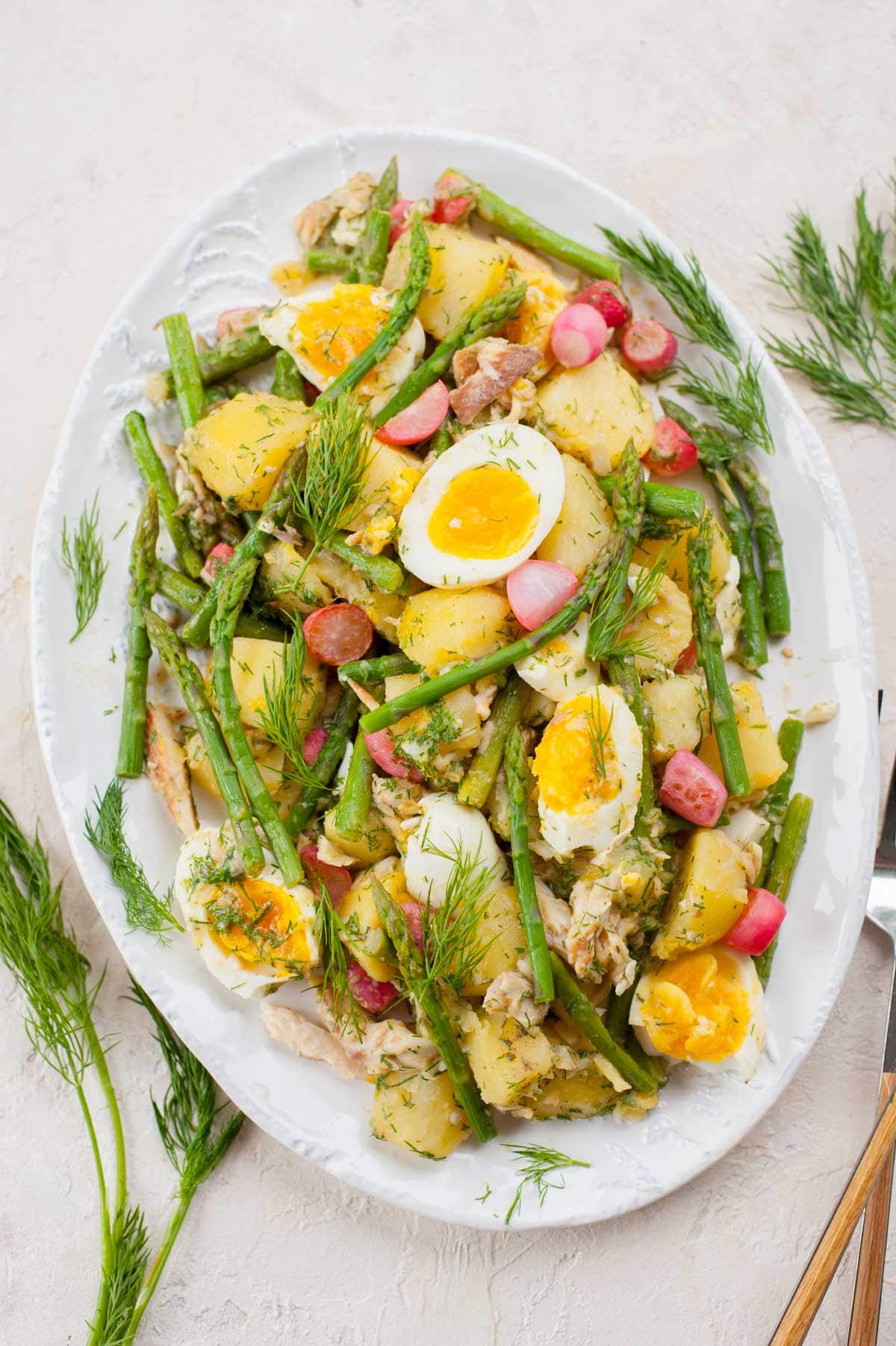 Potato and asparagus salad with eggs and smoked trout