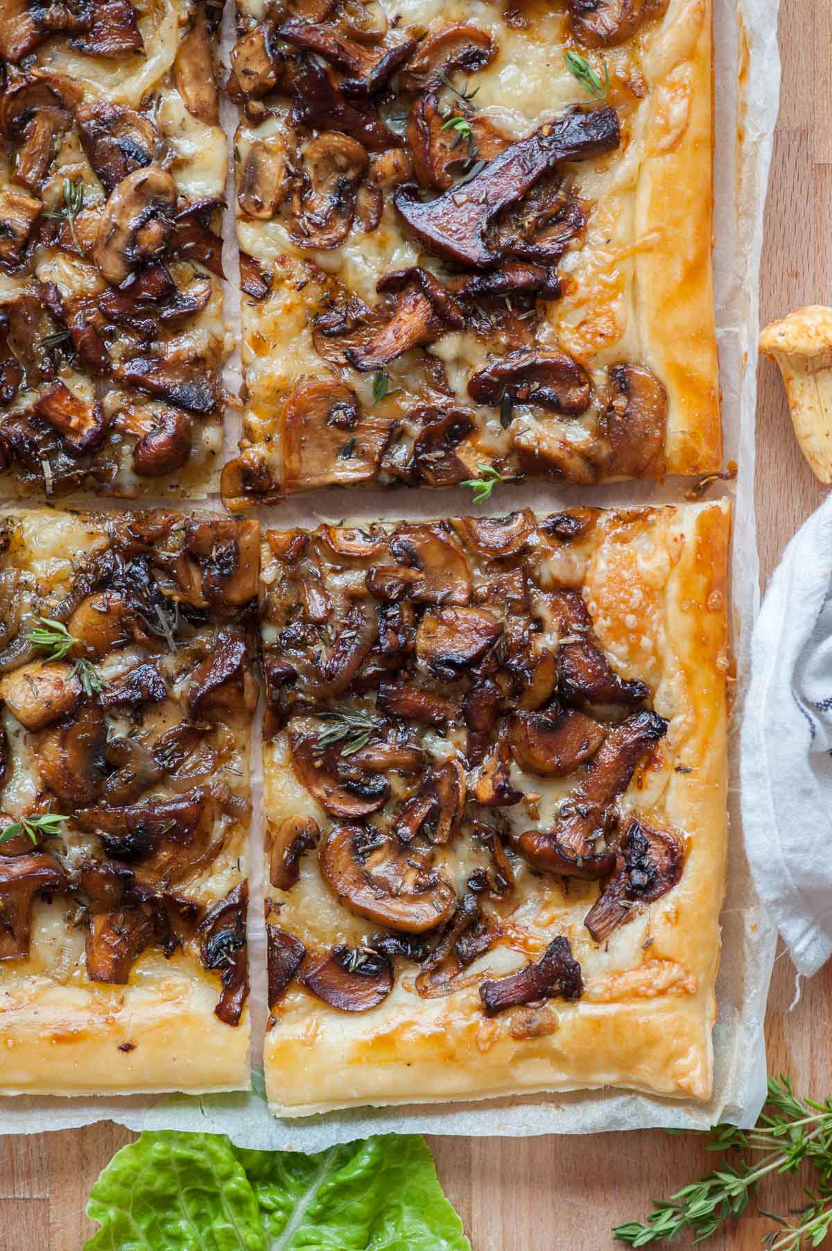 A close up picture of puff pastry mushroom tart.