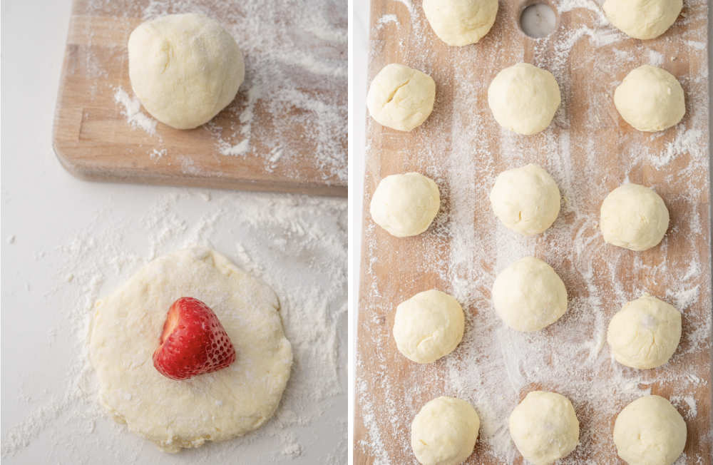 Flattened knedle dough with a strawberry on top. Strawberries wrapped in dough on a wooden board.