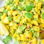 Mango avocado salsa on a white plate.