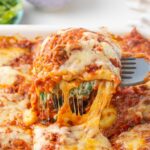 Ravioli lasagna in a delicious ravioli casserole that is crowd-pleasing and easy to make. You just need to layer store-bought ravioli with meat tomato sauce, spinach ricotta layer, and cheese and you'll have a delicious dinner for a couple of days!