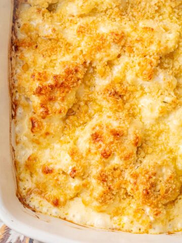 Cauliflower gratin in a white casserole dish.