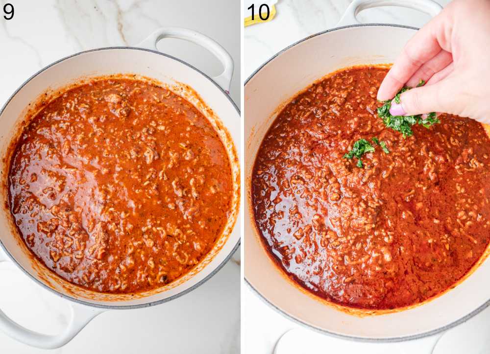 Spaghetti meat sauce in a white pot is being seasoned with chopped fresh basil.