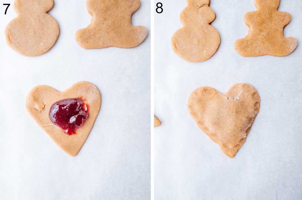 Heart-shaped cookie dogh with plum preserves on top.