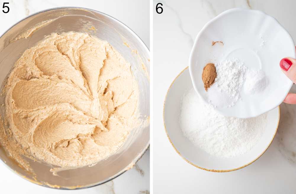 Whipped dough in a bowl. Baking powder, baking soda, salt, and cinnamon are being added to a bowl with flour.